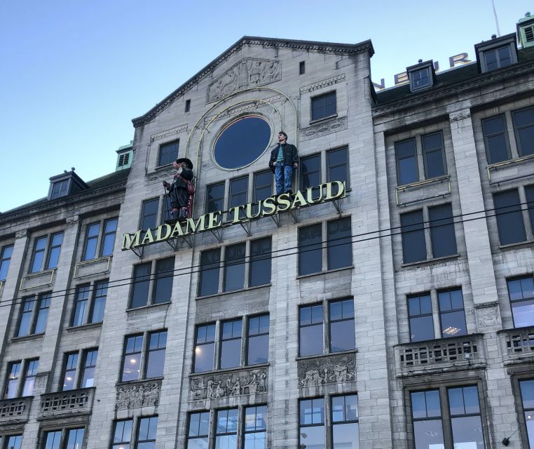Amsterdam: City Center Walking Tour in italian - Starting at Dam Square with a Blue Umbrella