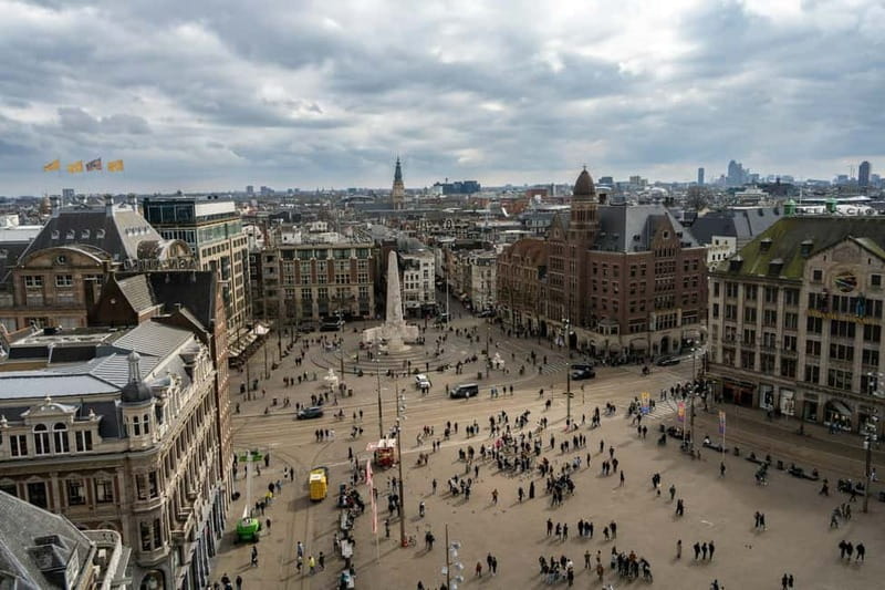 Amsterdam: Iconic Canals & Historic Sights Walking Tour - Starting at Dam Square and the National Monument