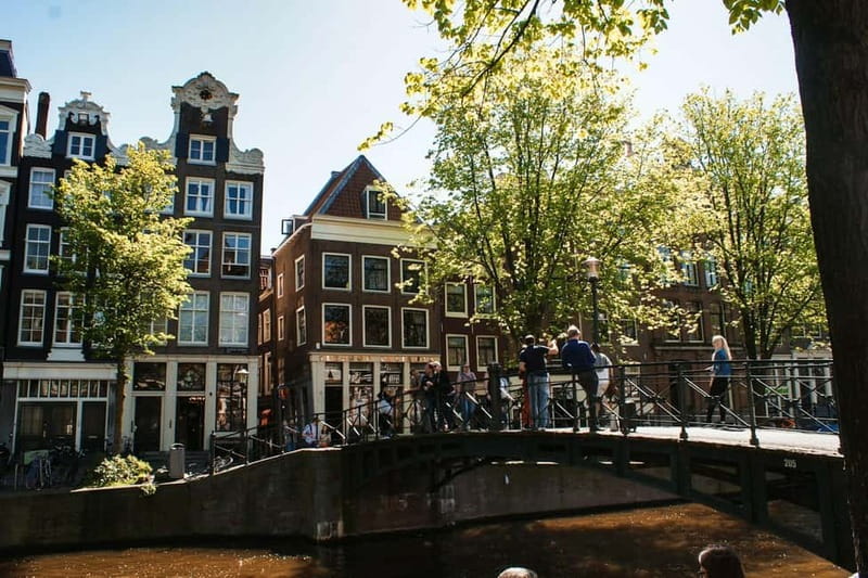 Amsterdam: Iconic Canals & Historic Sights Walking Tour - Price, inclusions, and who gets the best value