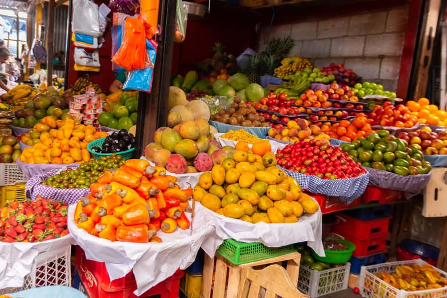 Antigua Guatemala: Street Food Walking Tour with Tastings - Market stalls, unfamiliar fruit, and everyday shopping
