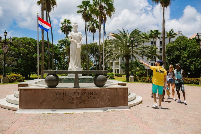 Aruba Downtown Historic and Cultural Walking Tour - Wilhelmina Park, statues, and iguanas