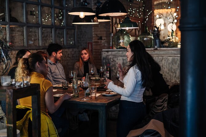 Barcelona: Guided Food Walking Tour with Tapas and Wine - Through Roman Walls Toward El Born