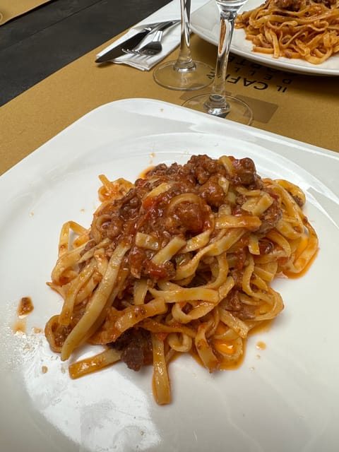 Bologna: Walking Food Tour and Highlights with a Local Guide - Via Drapperie and Bologna’s food streets