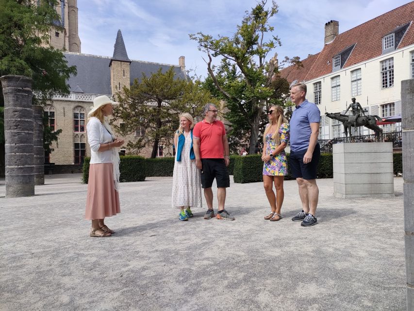 Bruges: Small Group Boat Cruise and Guided Walking Tour - The canal cruise beneath Bruges’ bridges