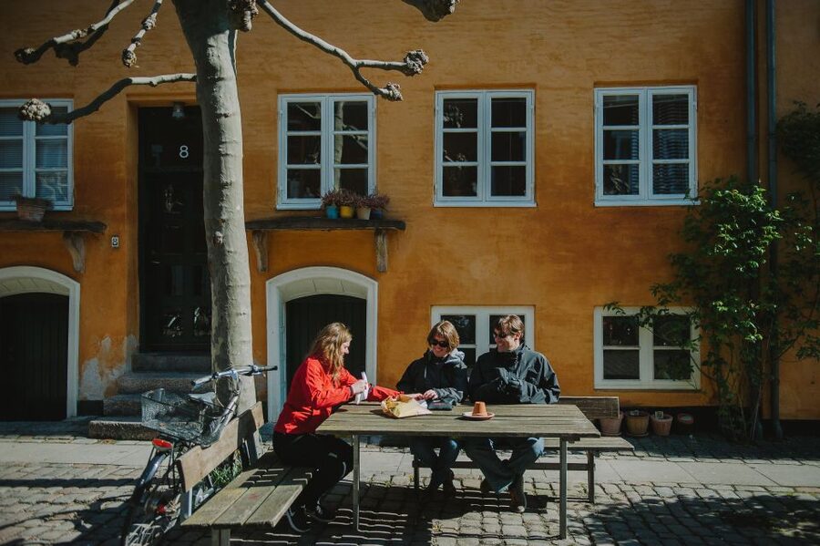Copenhagen: Hygge and Happiness Culture Walking Tour - Cobblestones, timber frames, and green corners