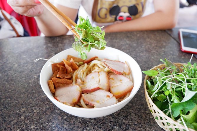 Evening Walking Food Tour, folk game and lantern boat - Vietnamese bingo and the pot-breaking game