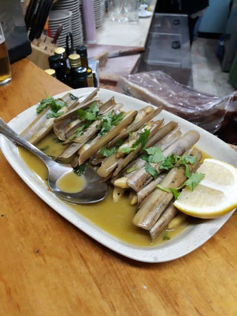 Faro: Old Town Guided Walking Food Tour - Stop two: small taverns and straightforward local food