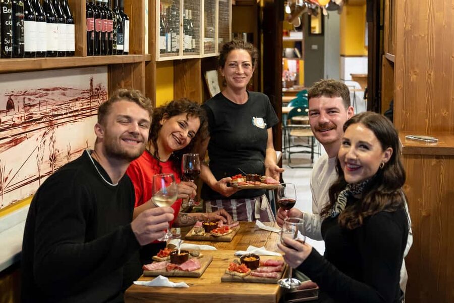 Florence: Food Walking Tour with Local Steak and Tuscan Wine - The old wine window and the Italian aperitivo