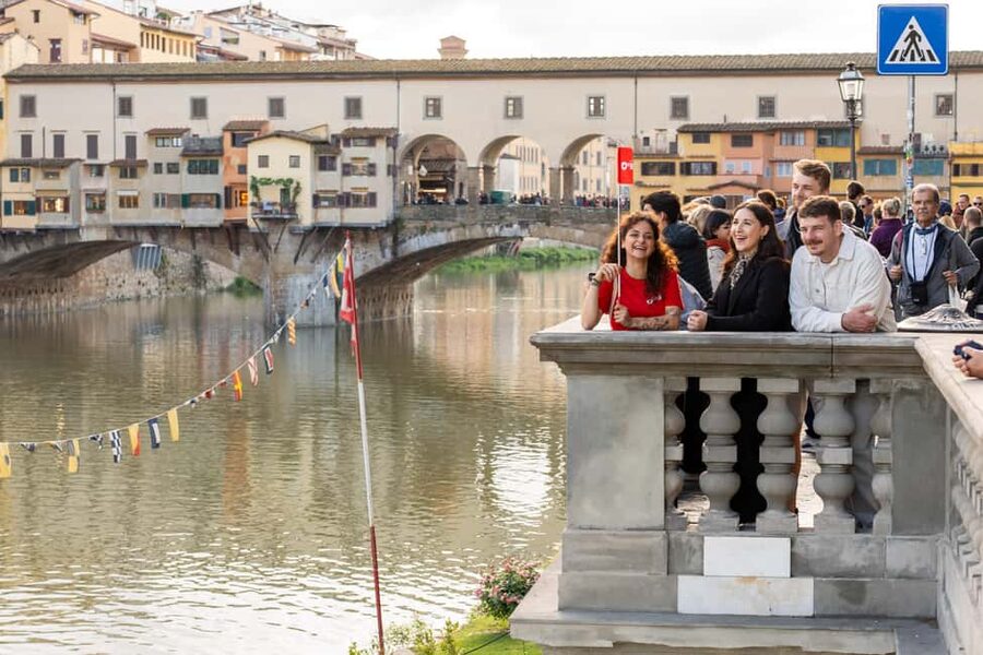 Florence: Food Walking Tour with Local Steak and Tuscan Wine - Crossing Ponte Vecchio toward Oltrarno