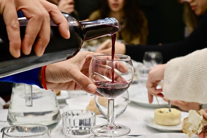 Lisbon Food Tour with 10+ Tastings of Local Delicacies & Wines - Cheese and pata negra at an artisan shop