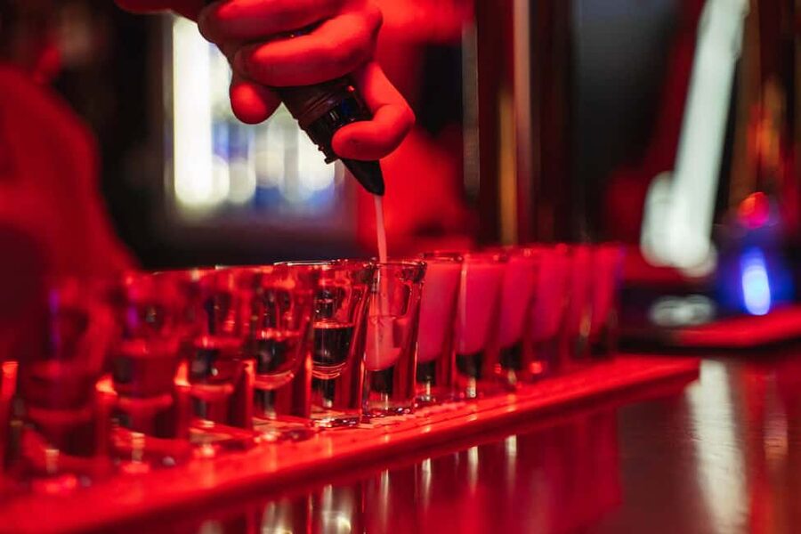 Lisbon: Private Dark History Walking Tour with Drinks - Walking through Bairro Alto after dark