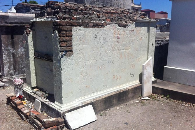 One Hour Saint Louis Cemetery Number One Walking Tour - The cemetery gates are the dividing line