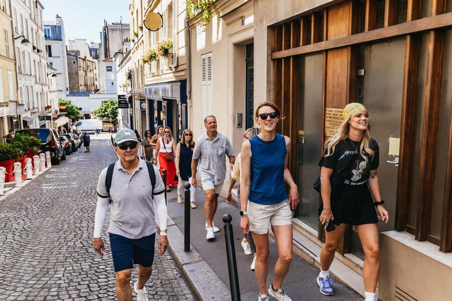 Paris: Montmartre Cheese, Wine & Pastry Guided Walking Tour - Walking through artists’ Montmartre to Place du Tertre