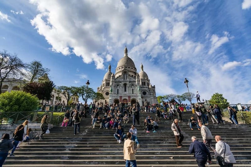 Paris: Montmartre Highlights Walking Tour with a Local Guide - Starting below Sacré-Cœur at Place Saint-Pierre