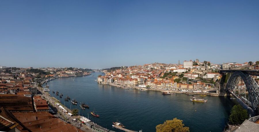 Porto: Walking Tour, Lello Bookshop, Boat and Cable Car - Crossing toward the Dom Luís I Bridge