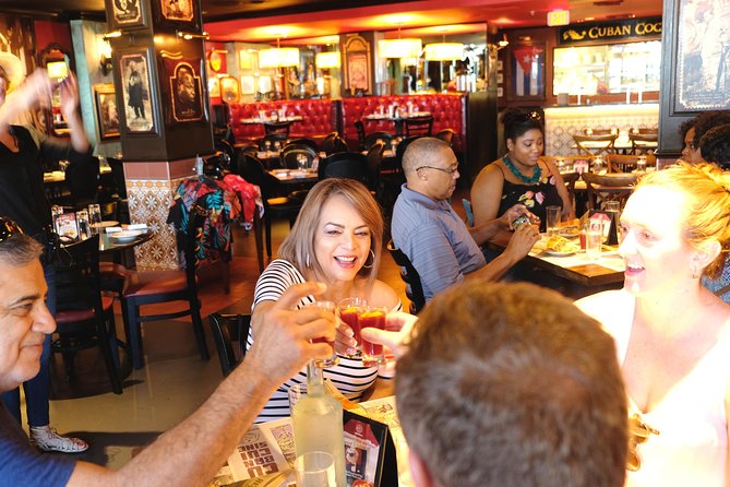 South Beach Cultural Food and Walking Tour - The Art Deco Historic District with a plate in hand