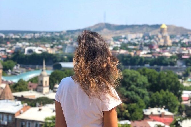 Tbilisi:Evening Walking & Talking Tour with Wine & Boat Ride - The clock tower that rewards a pause
