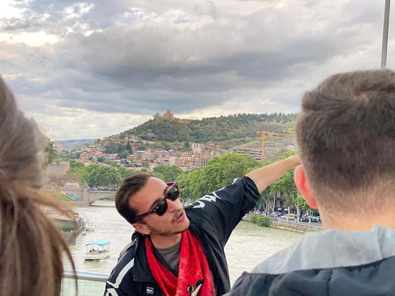 Tbilisi: Evening Walking Tour with Wine & Boat Ride Options - The Peace Bridge after dark